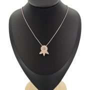Brushed silver and cubic zirconia “leaf” pendant