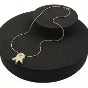 Brushed silver and cubic zirconia “leaf” pendant